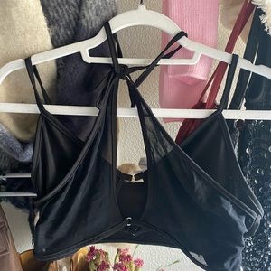 Black crop top with intricate detailing.